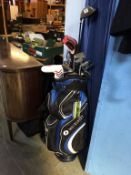 A golf trolley, Dunlop golf clubs etc.