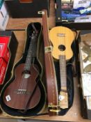 Two Ukuleles and cases