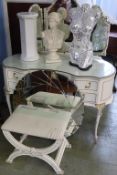 A cream dressing table and stool