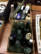 Two boxes of vintage bottles