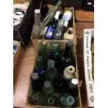 Two boxes of vintage bottles