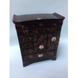 A small Oriental lacquered jewellery cabinet