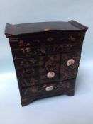 A small Oriental lacquered jewellery cabinet