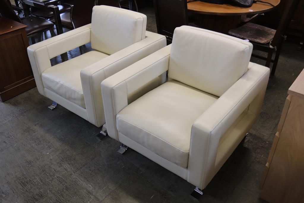 A pair of cream leather E. Poltrone 'Bizzarri' armchairs