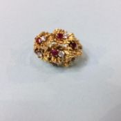 An 18ct diamond and ruby ring, size L/M, 12 grams