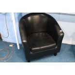 A black tub armchair