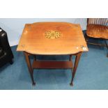 An Art Nouveau mahogany two tier occasional table