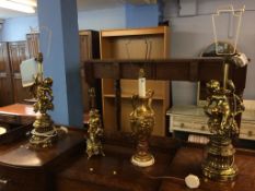 Four ornate gold coloured table lamps