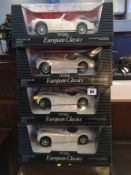 Four boxed ERTL cars