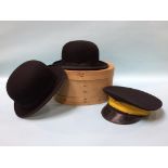 Two bowler hats and a cap
