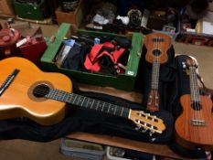 Guitar, box of accessories and two Ukuleles