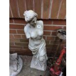 A garden statue of a Classical Nude
