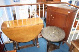 An oak corner cabinet, gateleg table and a brass topped table