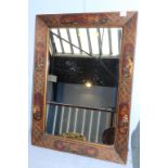 A decorative Oriental framed mirror