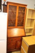 A reproduction mahogany bureau bookcase