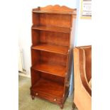 A Multiyork reproduction mahogany waterfall bookcase. 57cm wide