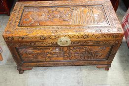 An Oriental carved Camphorwood chest