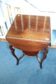 A mahogany drop flap occasional table