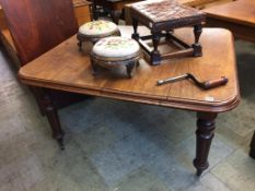 A Victorian mahogany extending dining table, with extra leaf