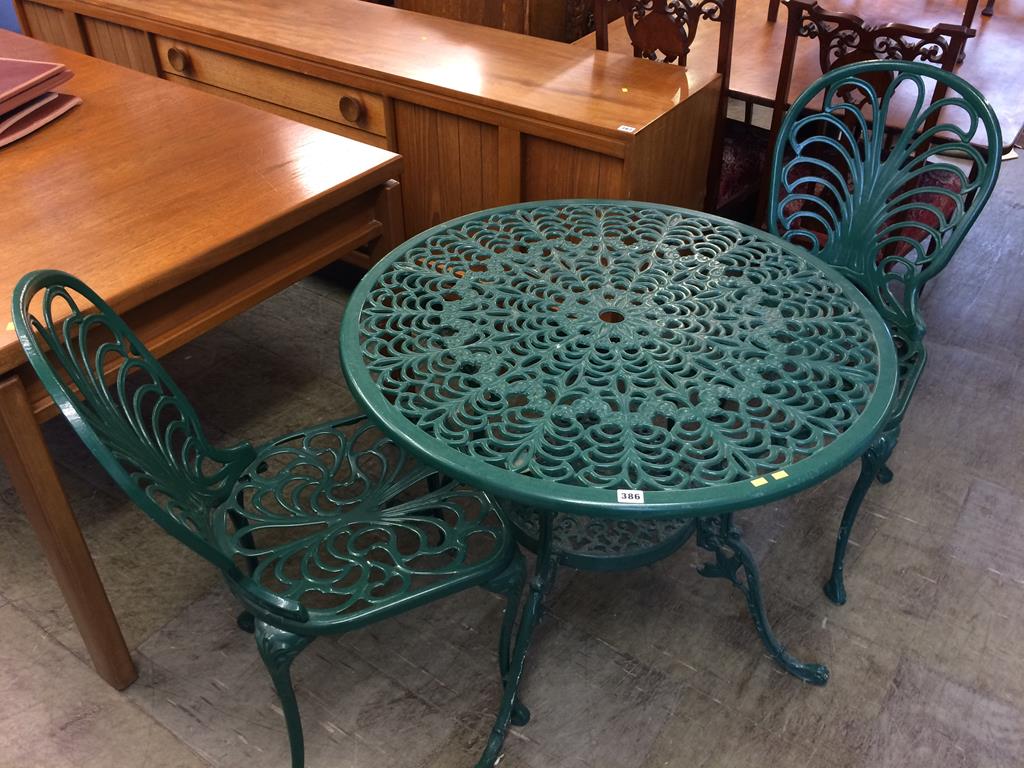 A green metal patio set