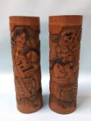 A pair of tall cased bamboo vases