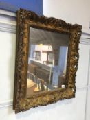 A gilt framed mirror