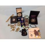 A box of assorted coins and jewellery