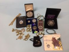 A box of assorted coins and jewellery