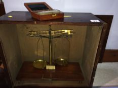 A set of brass and mahogany chemist scales by H.L. Becker Fils and Co. and weights