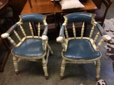 A pair of painted and blue leather armchairs
