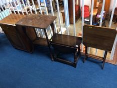 An oak bedside cabinet, three occasional tables