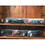 Seven boxed model trains