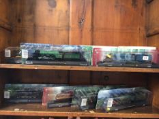 Seven boxed model trains