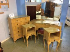 A chest of drawers, dressing table and a pair of bedside cabinets