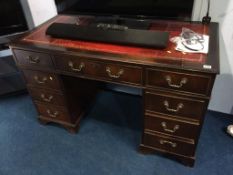 A reproduction pedestal desk