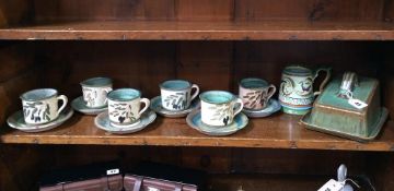 A stoneware tea set and a cheese dish