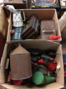 Two boxes of various oil cans etc.