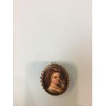 A miniature portrait, mounted in a 9ct gold brooch, 15g total