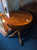 A yew circular drum table