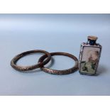 An Oriental scent bottle and two Oriental bamboo bracelets, mounted with white metal