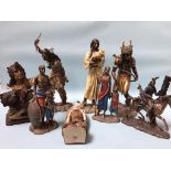 Six model Red Indian figures and two 'Masai' figures