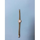 An 18k gold ladies Longines wristwatch