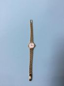 An 18k gold ladies Longines wristwatch