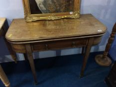 A 19th century mahogany fold over tea table