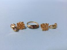 An 18ct gold ring, a pair of earrings 3.5g and another pair of earrings