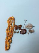 An amber coloured necklace, an antique seed pearl mounted brooch etc.