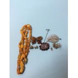 An amber coloured necklace, an antique seed pearl mounted brooch etc.
