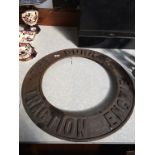 A cast iron circular ring 'The Burrell Traction Engine'