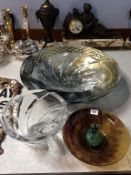 Four glass bowls and a paperweight