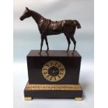 A late 19th century slate clock, surmounted by a bronze horse, the movement by Raingo of Paris, 8